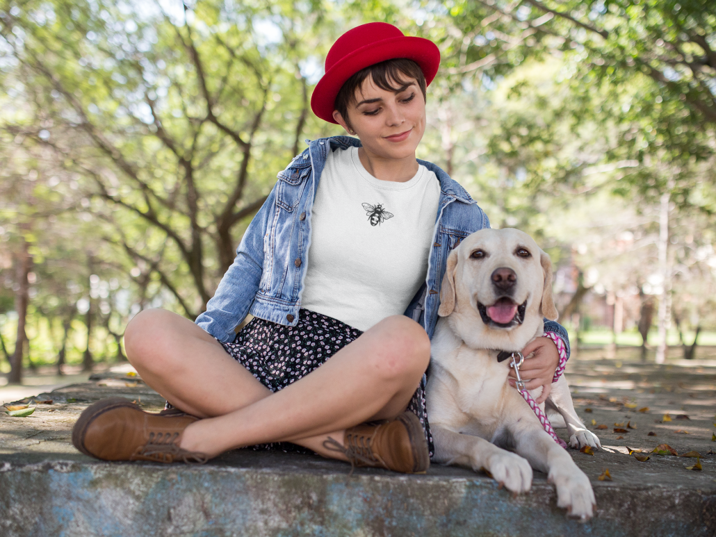 Woman with dog and bee tee shirt
